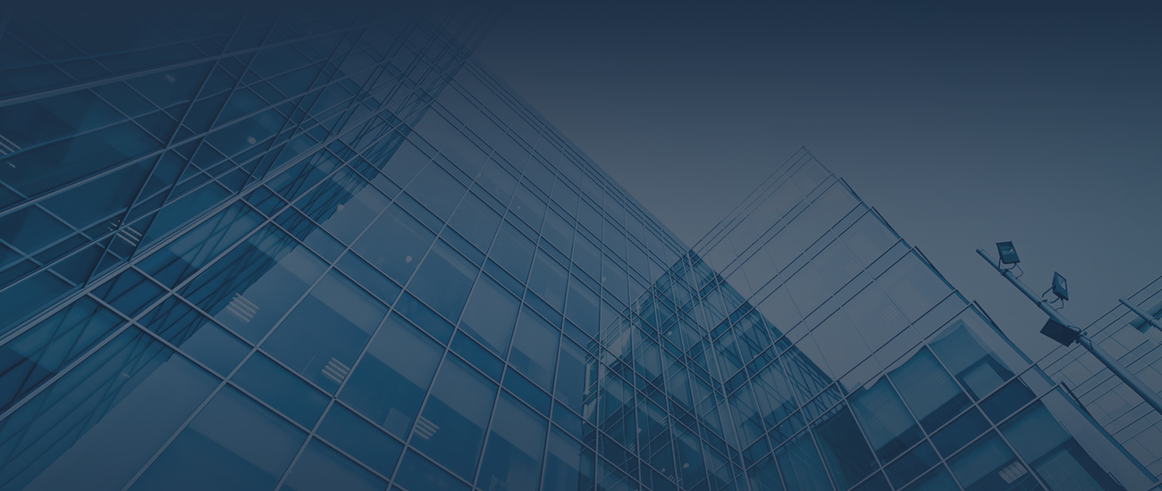 A blue building stands against a clear blue sky, creating a harmonious blend of colors in the scene.